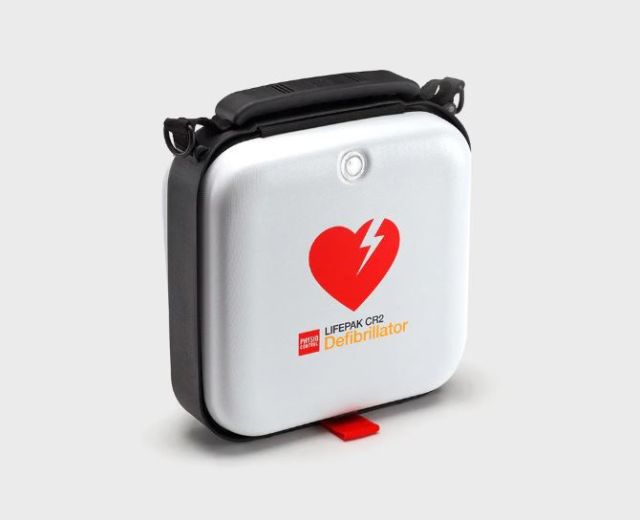 White Lifepak CR2 defibrillator hard shell carry case with black carry handle, red defibrillator universal heart logo and adjustable carry strap