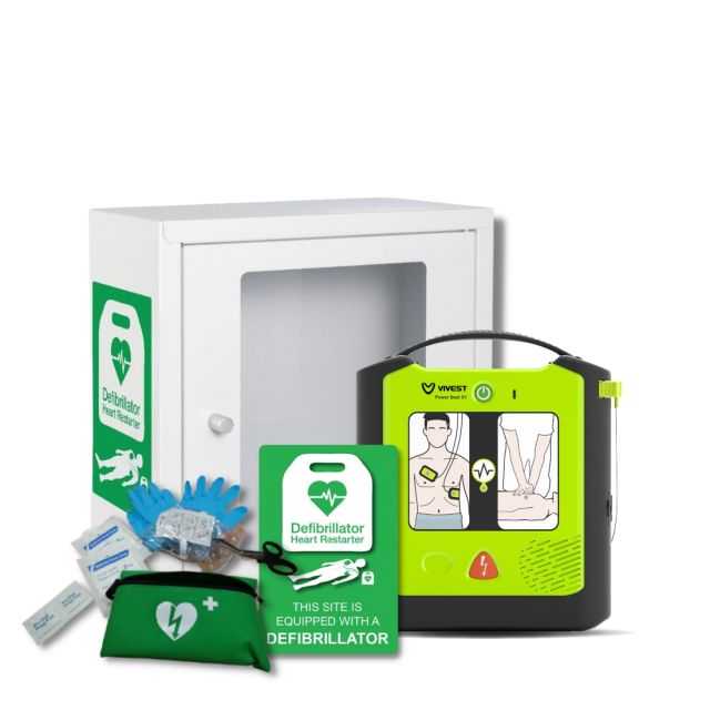 Lime green Vivest semi-automatic public access defibrillator next to the indoor, white, square, metal indoor defibrillator cabinet. The cabinet has a large viewing window for inspecting the status of the defib.

The image also shows the rescue ready kit