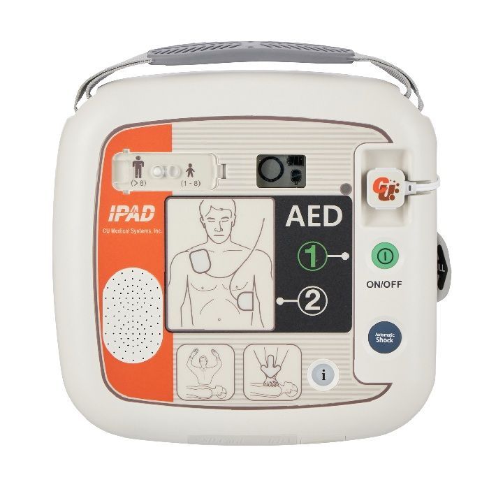 White C U Medical iPAD SP1 defibrillator showing pad placement on adult patient with automatic shock button