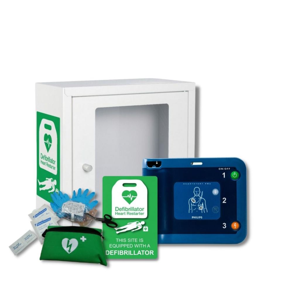 Philips Heartstart FRx Semi-Automatic Defibrillator next to indoor metal defibrillator cabinet in white, with a large viewing window to check on the status of the defibrillator without needing to open the cabinet. Next to an indoor defibrillator wall sign