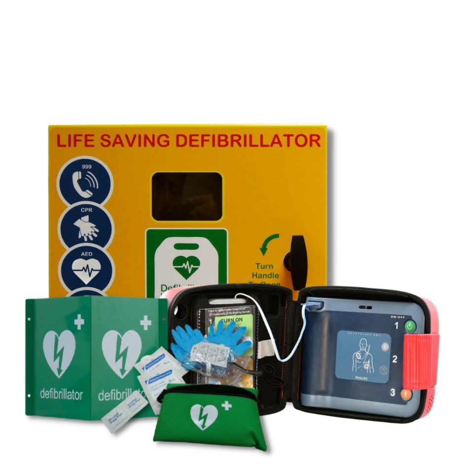 
Philips Heartstart FRx Semi Automatic Defibrillator wrapped in a ribbon, alongside the Defib Store 1000 steel unlocked outdoor defibrillator cabinet next to 3D Defibrillator Outdoor Wall Sign and Defib Store Rescue Ready Kit