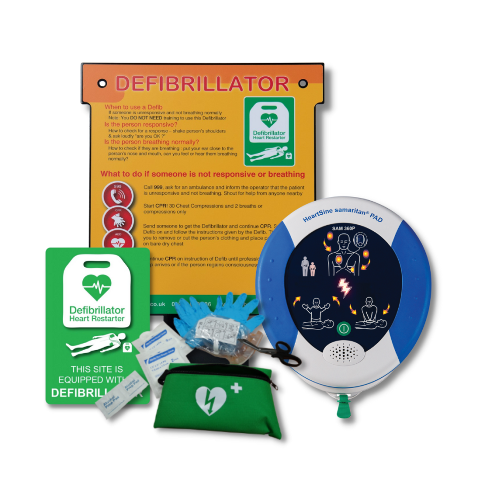 Indoor metal wall hanger for a defibrillator next to the Heartsine Samaritan 350P defibrillator showing pad placement and CPR instruction graphics, next to a wall sign and rescue ready kit