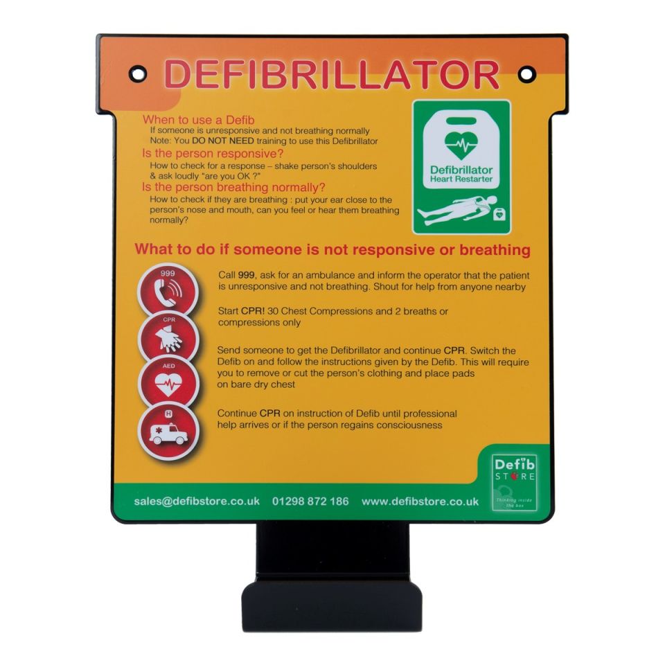 Indoor metal wall hanger for a defibrillator with instructions on what to do if someone isn't responsive or breathing